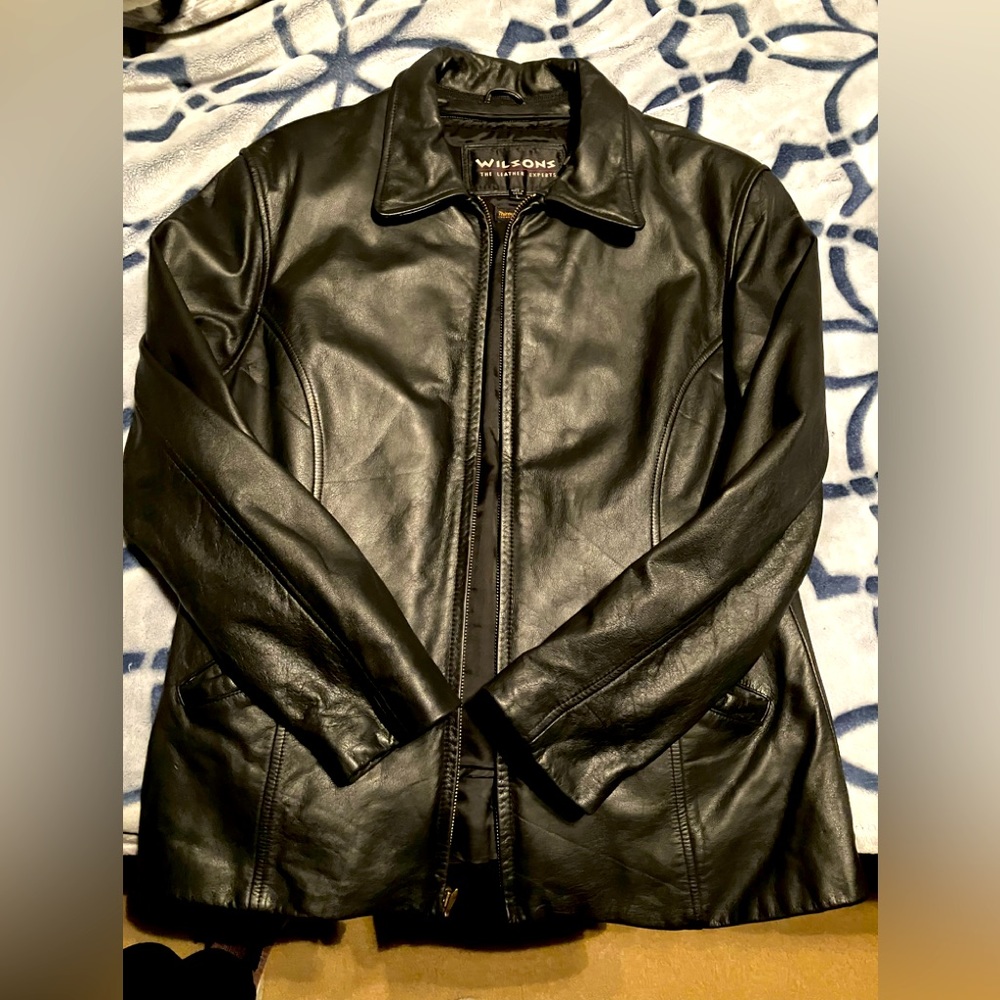Woman’s Wilson’s large black leather jacket.